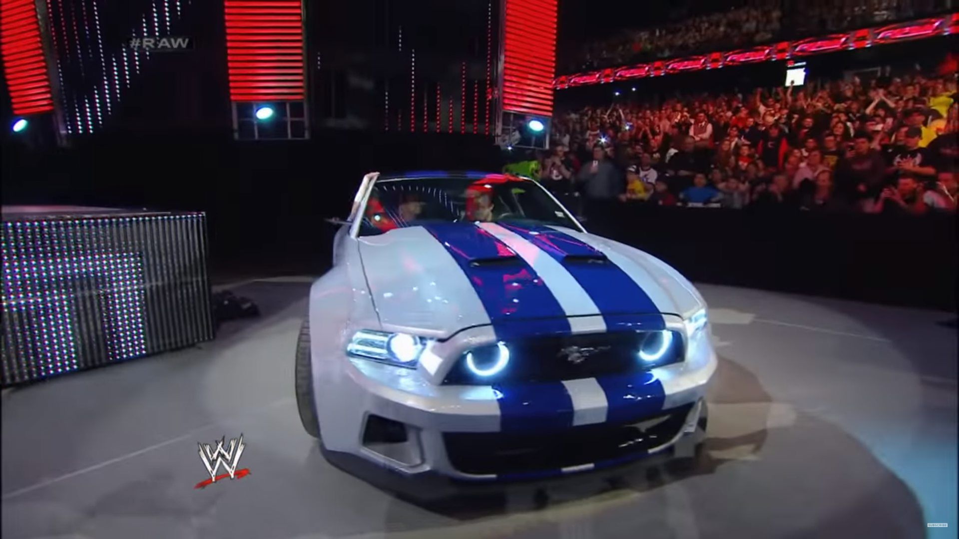 Aaron Paul in his Need For Speed Mustang Shelby in WWE Raw