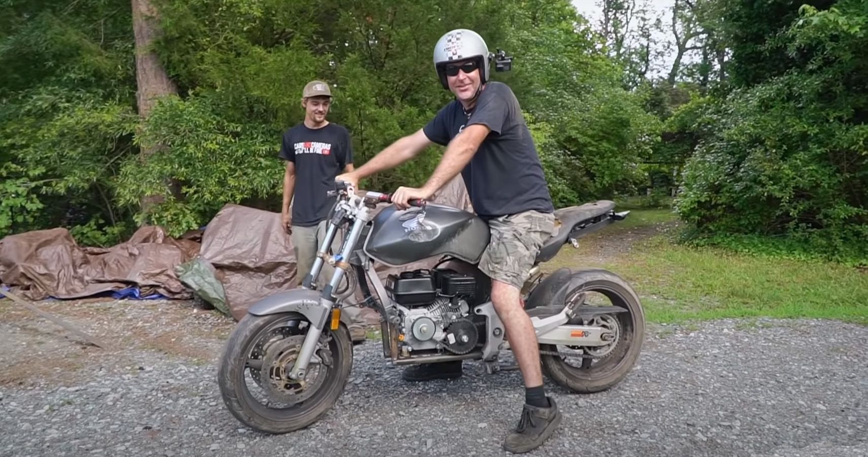 Cars and Camera crew test out a Honda bike using a lawnmower engine