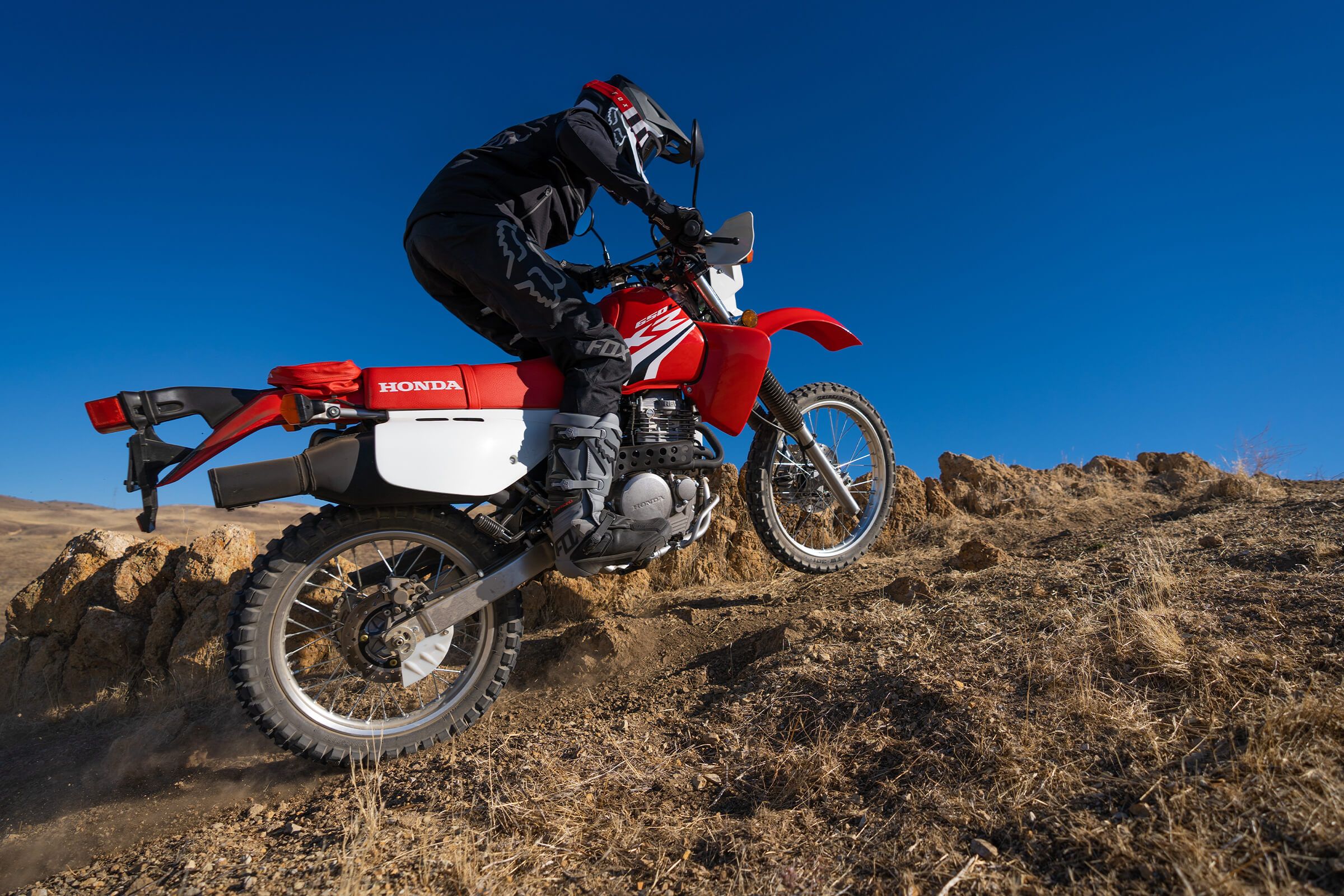Red XR650L riding in dirt