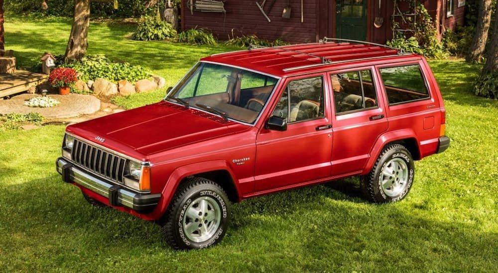 Red Jeep Cherokee XJ Parked On The Lawn