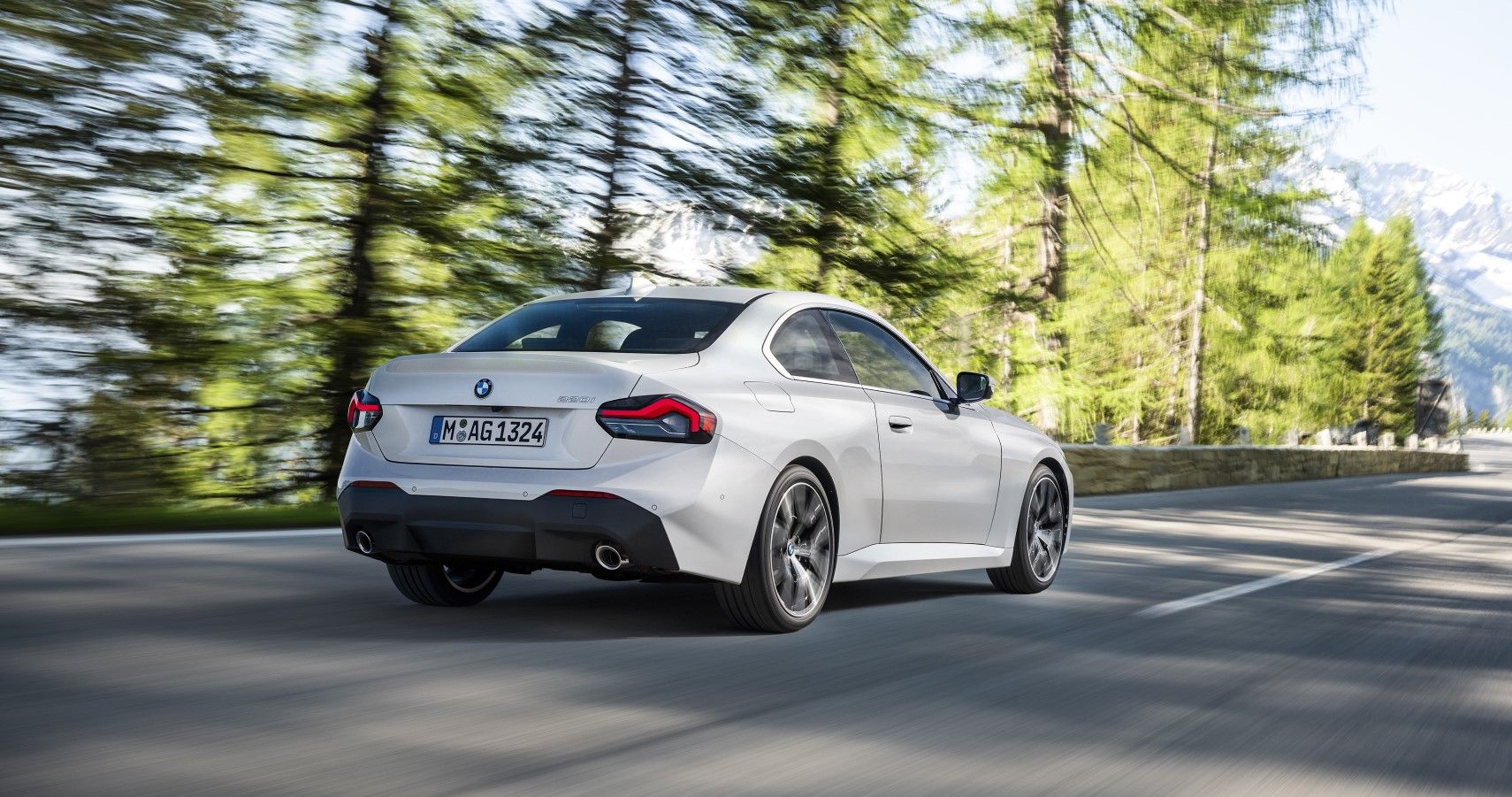 2022 BMW 2-Series Coupe rear third quarter accelerating view