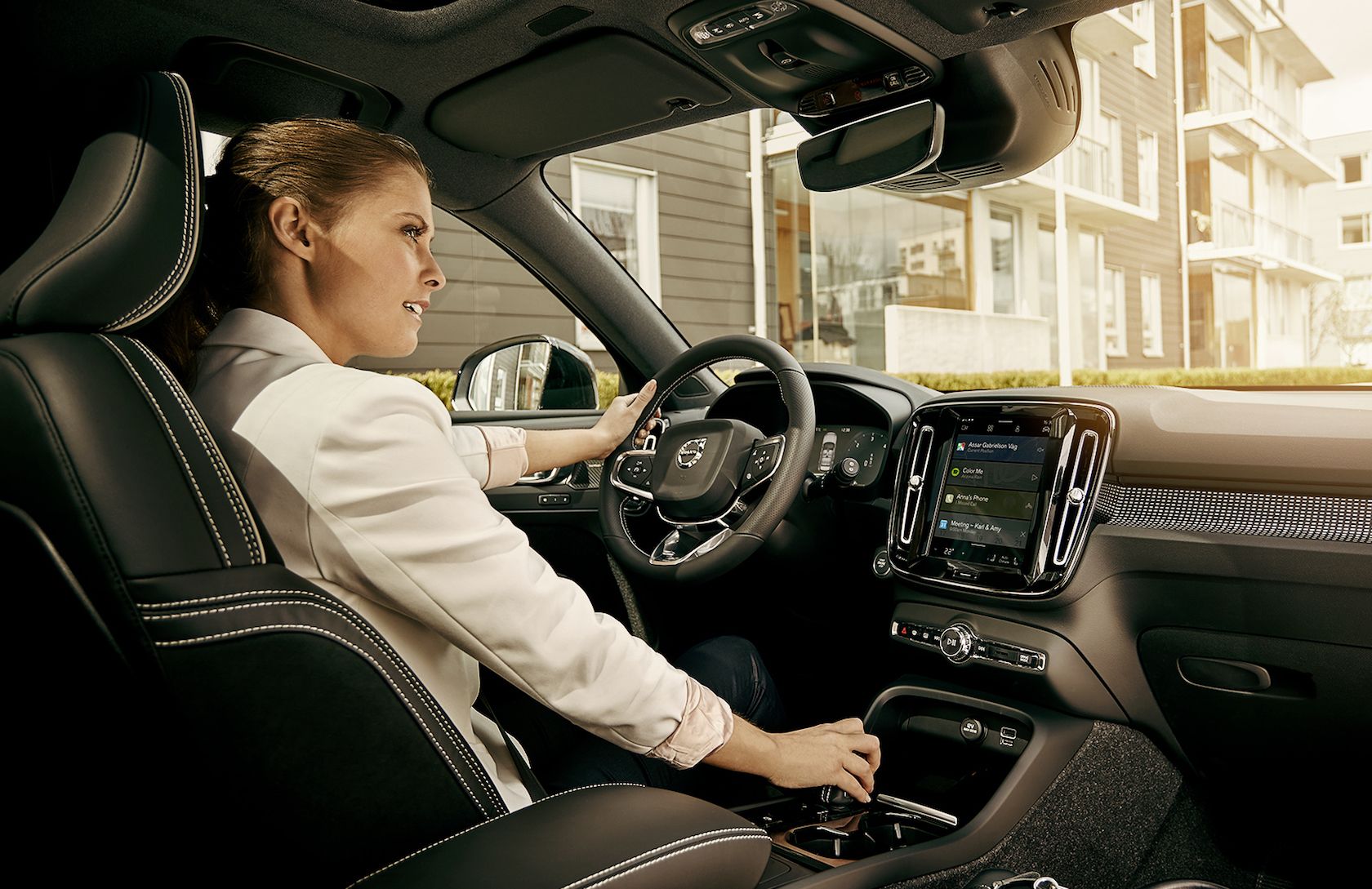 Woman operating interior of a Volvo