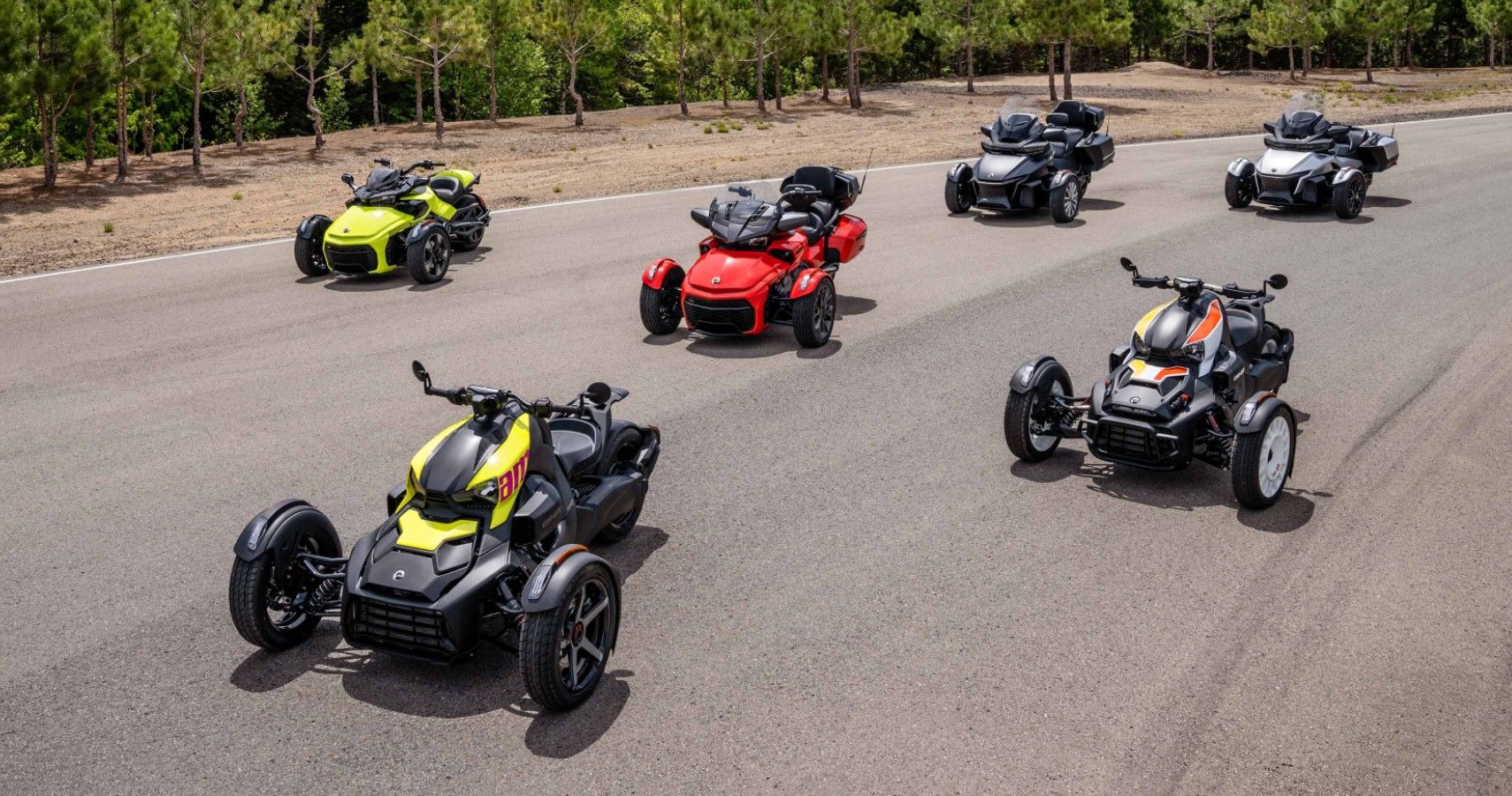 The 2022 Can-Am on-road model lineup parked on a road.