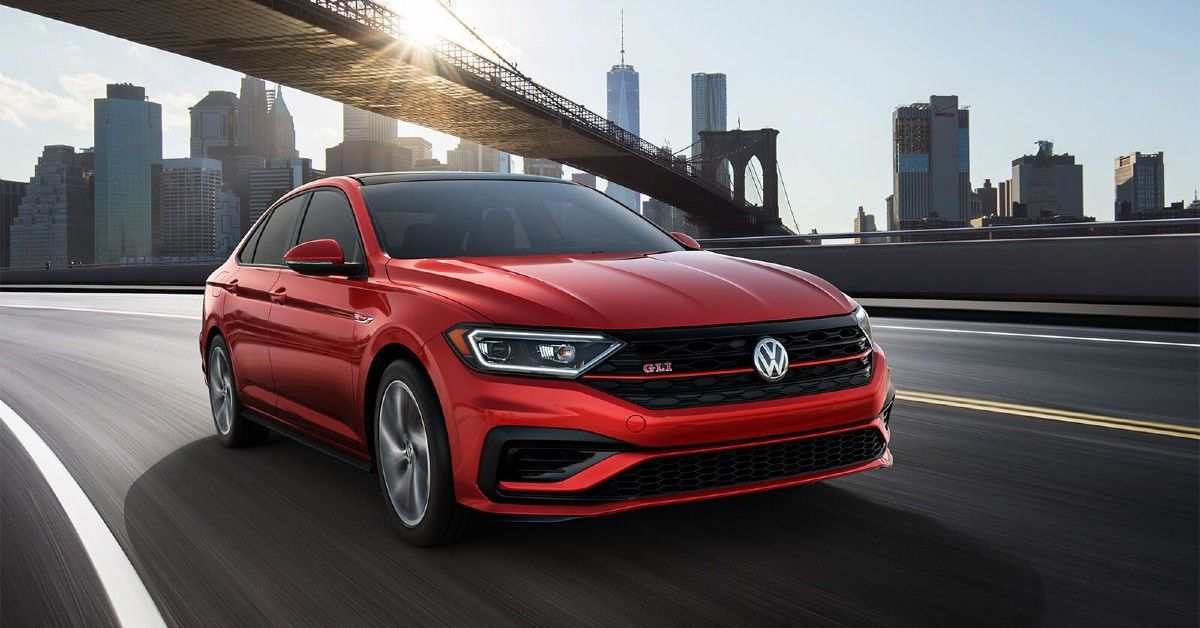 An Image Of A Red 2022 VW Jetta GLI In Motion