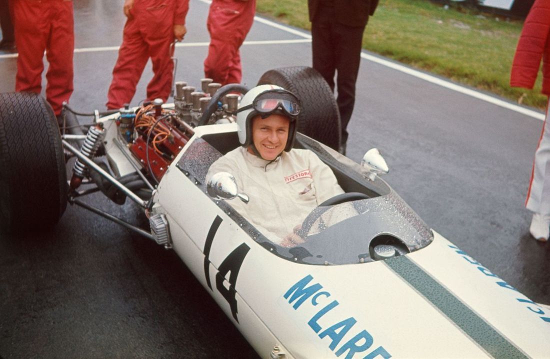 Bruce McLaren Driving A Race Car