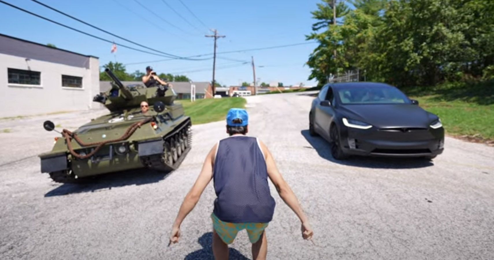 CVRT military vehicle takes on a Tesla Model X in a drag race