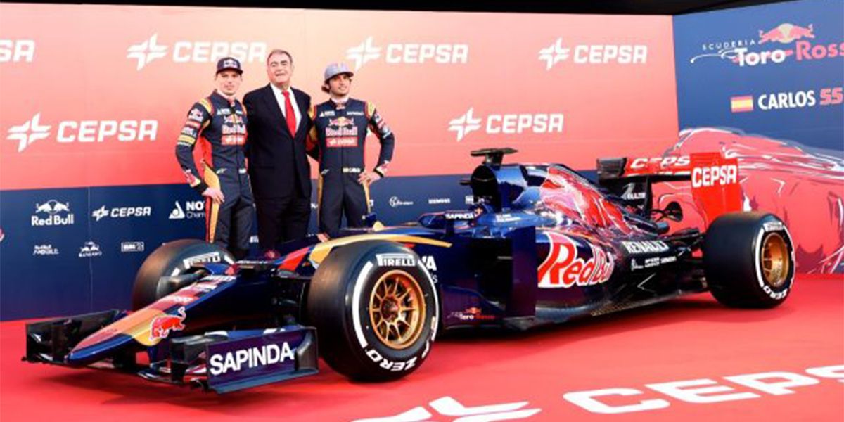 Carlos Sainz Alongside His Torro Rosso Car