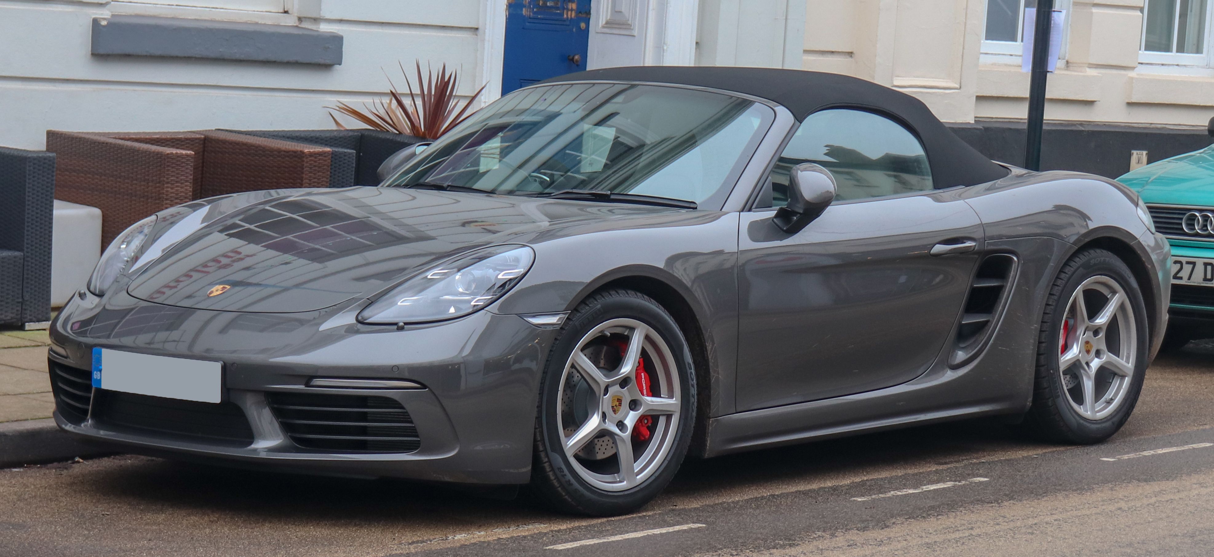 Silver Porsche Boxster, front and side view