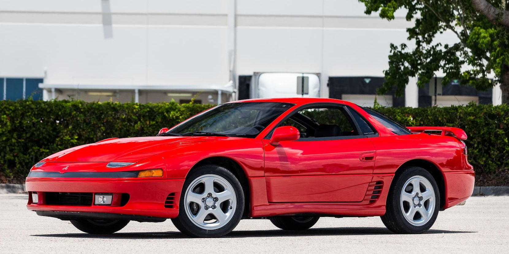 Red 1991 Mitsubishi 3000GT VR4 on the driveway