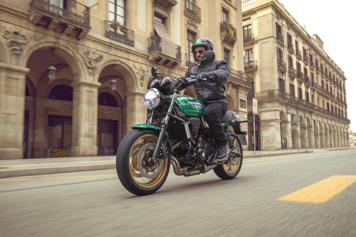 A rider on a 2022 Kawasaki Z650RS in the city.