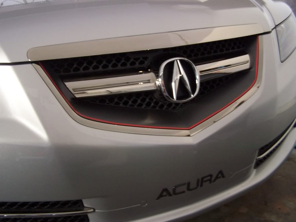 Close up on Acura hood ornament