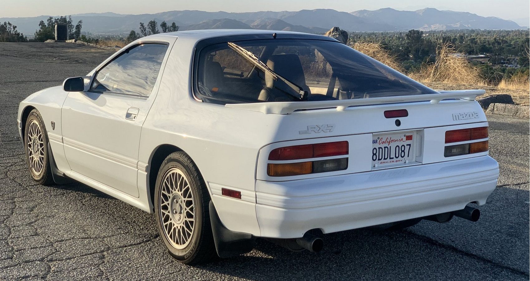 White Mazda RX7 on the road