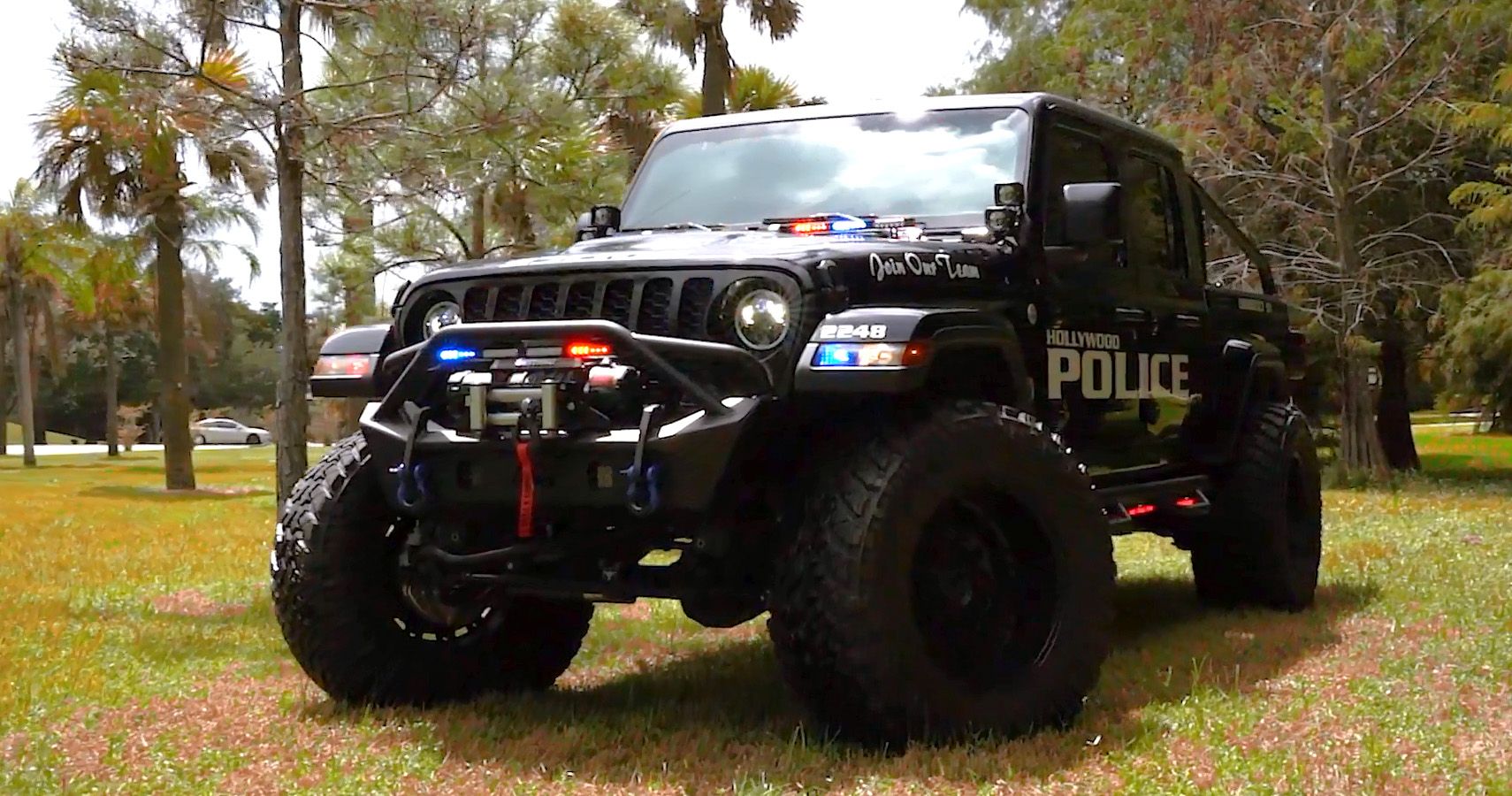 SoFlo Police Jeep parked on lawn