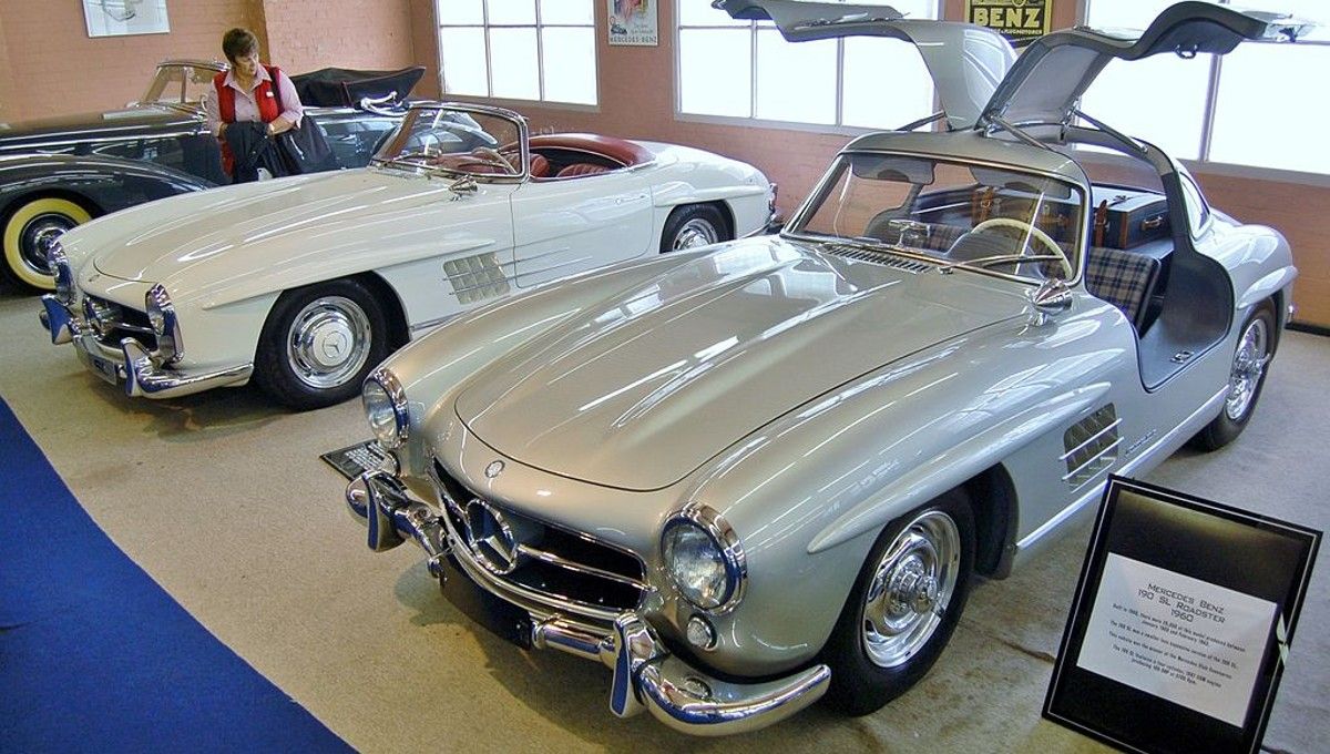 A picture of a classic car collection showing the Mercedes-Benz 300 SL.