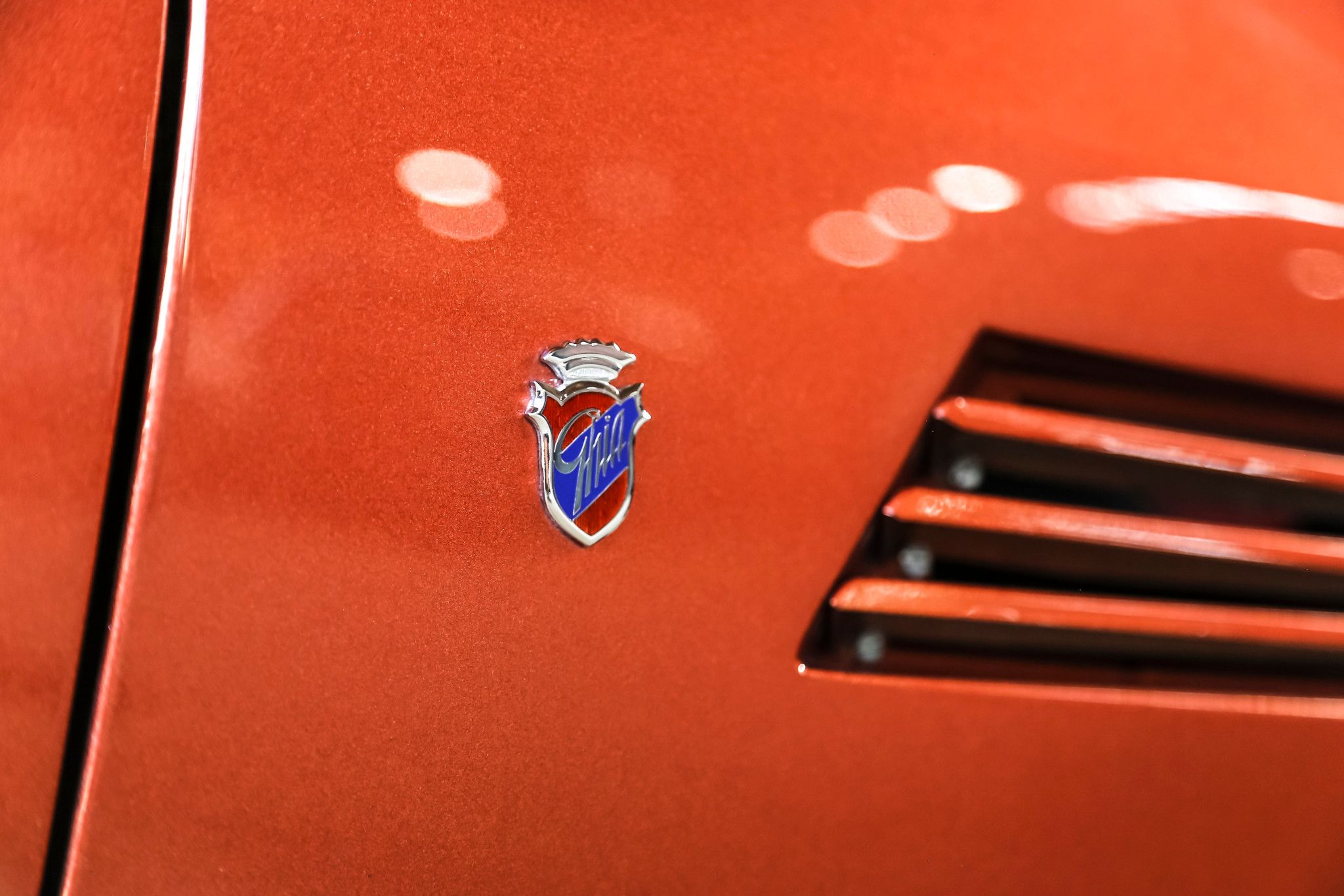 The logo of the proud carrozzeria, Ghia on a Maserati Ghibli