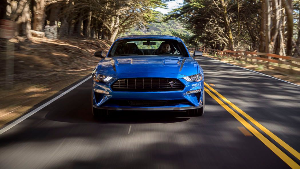 The Front View Of A Blue Ford Mustang
