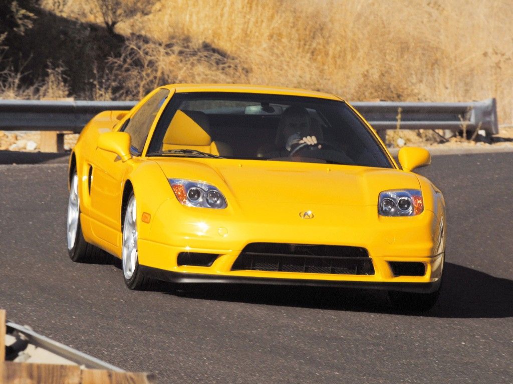 A Yellow 2003 Acura NSX-T In Motion