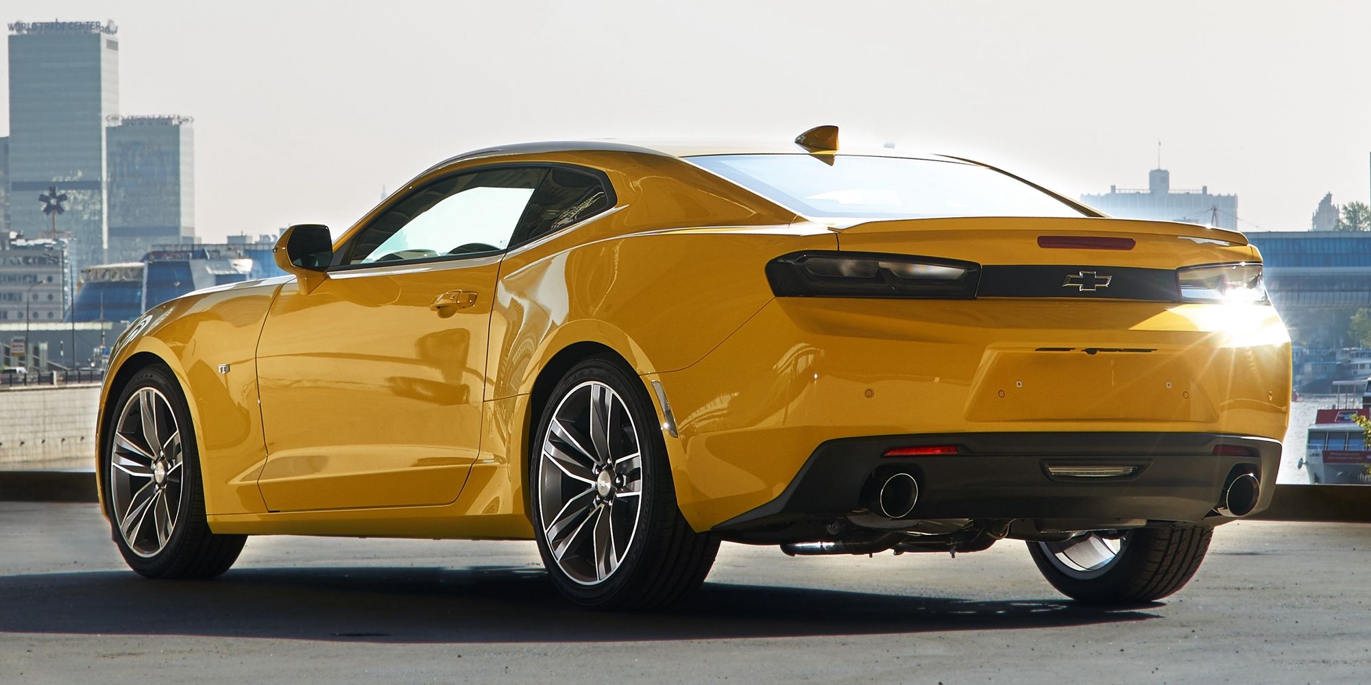 The rear of a yellow Camaro 