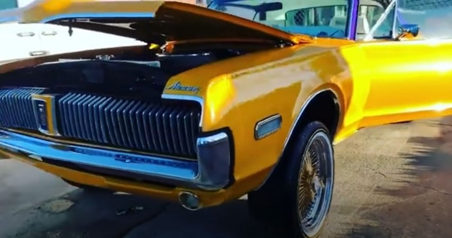 Gold 1968 Ford Mercury Cougar with hood and side door open