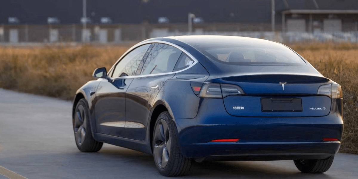 The Rear Of A Blue Tesla Model 3