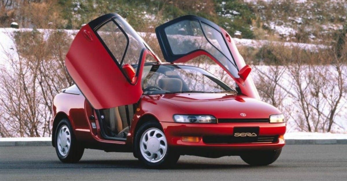 Toyota Sera, red, parked on the street, butterfly doors. Pinterest  (1)