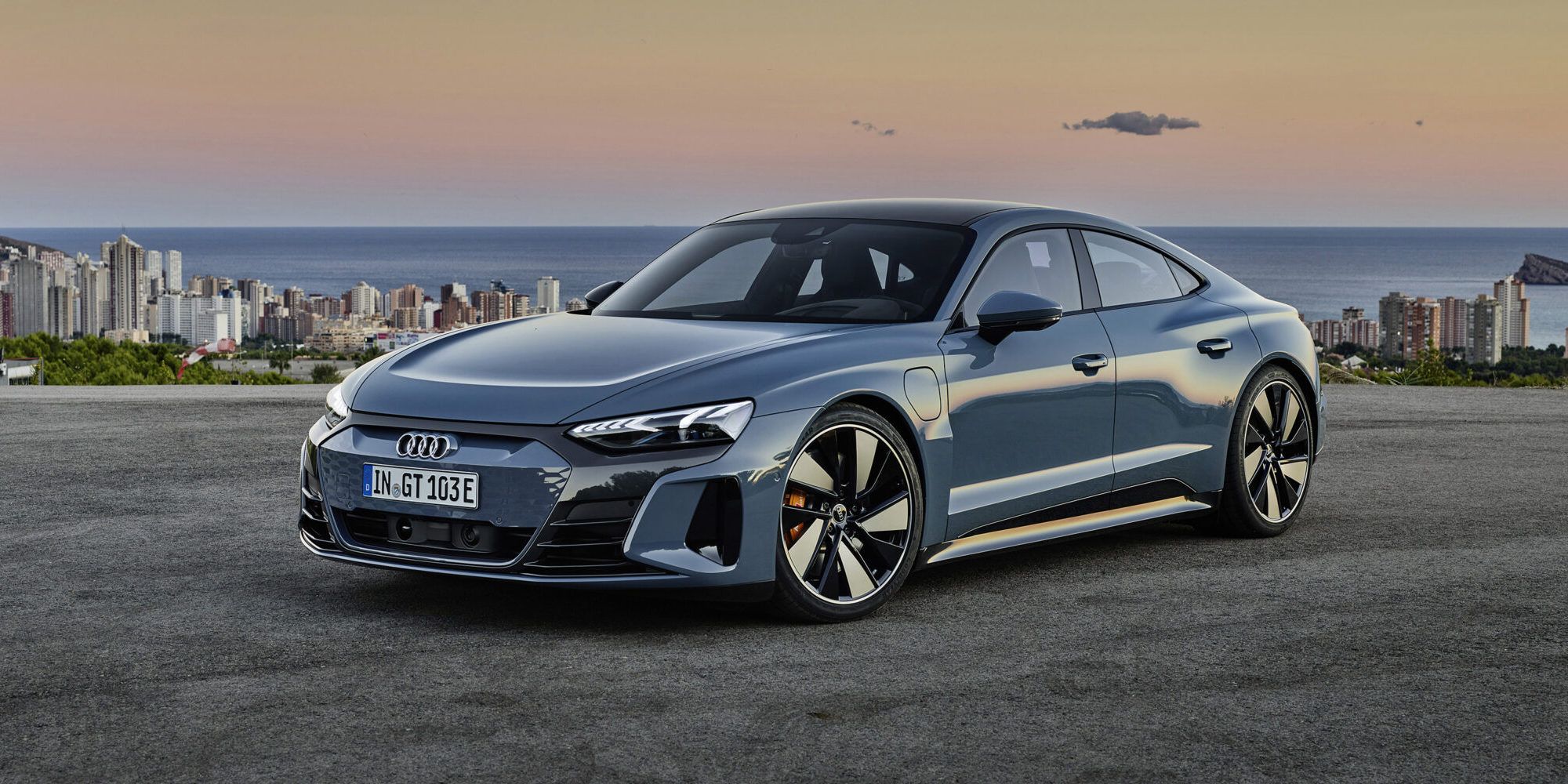 2022 Audi E Tron GT parked with city landscape in background