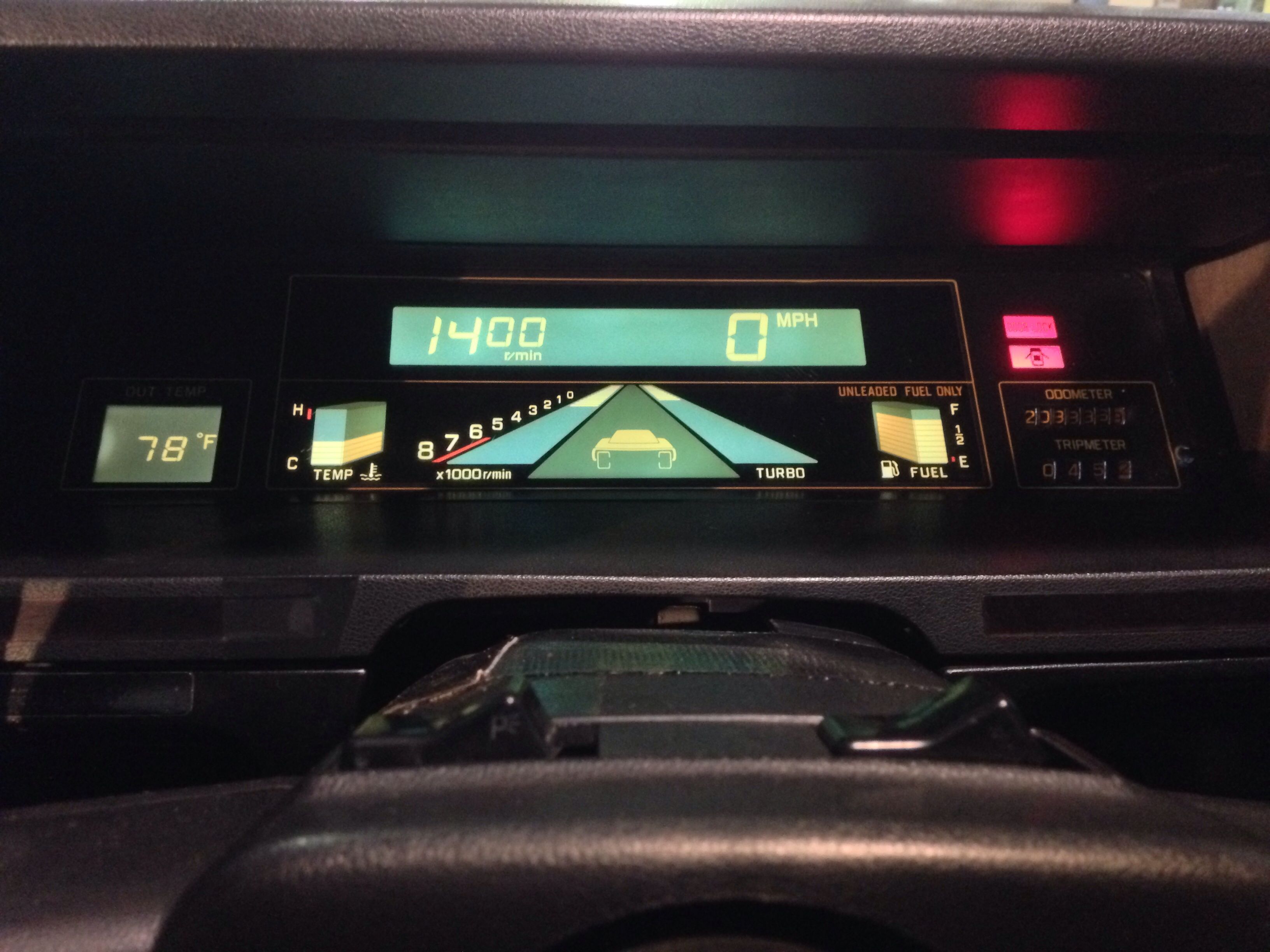 Gauge cluster Subaru XT video game control speedometer tachometer driving horizon turbo lines 3d shape 1980s