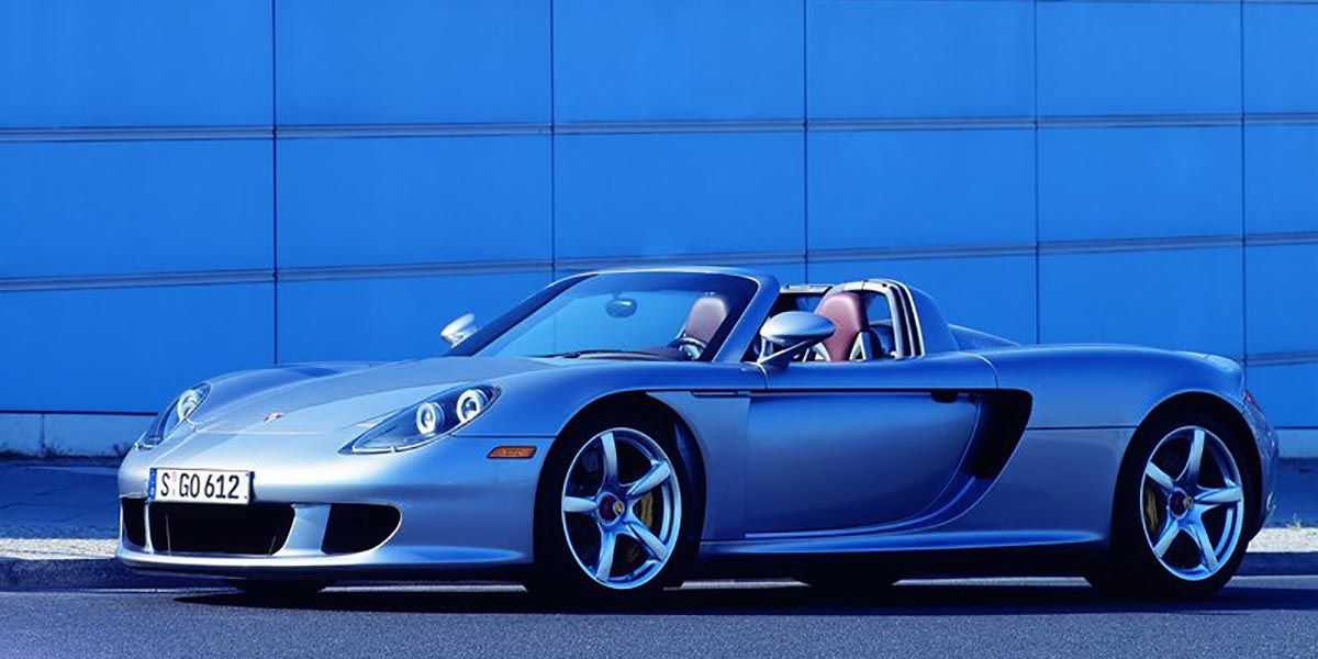 Silver  Porsche Carrera GT Supercar  With Roof Down
