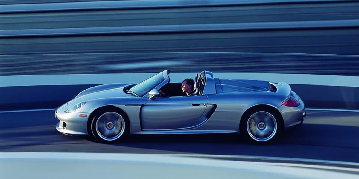 Silver 2004 Porsche Carrera GT Supercar Driven Fast On Track