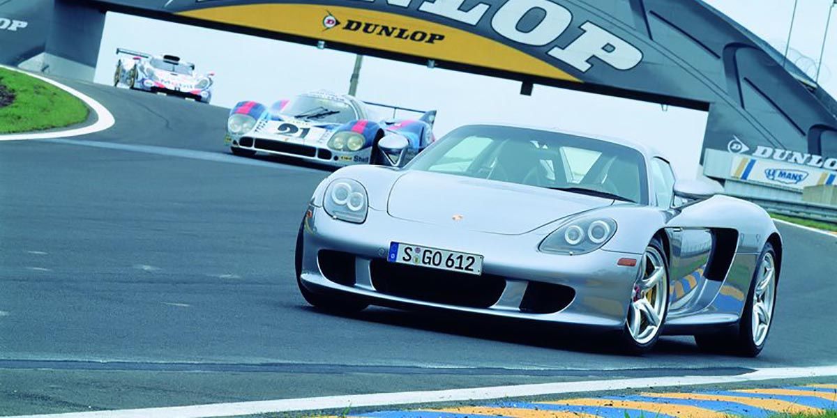 The 2004 Porsche Carrera GT Supercar Driven On The Track With Porsche Race Cars