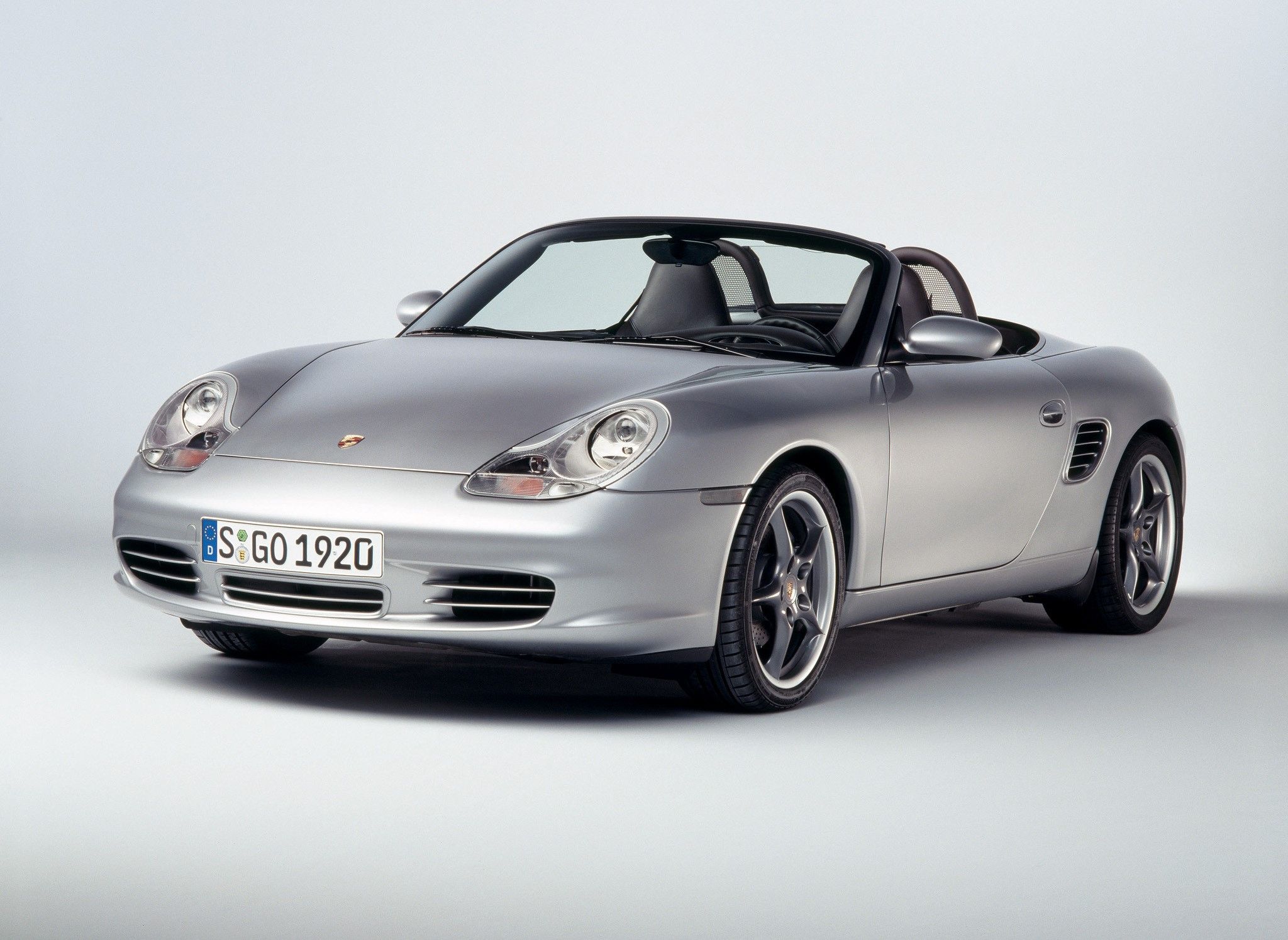 Silver Porsche Boxster from 2004, in a showroom