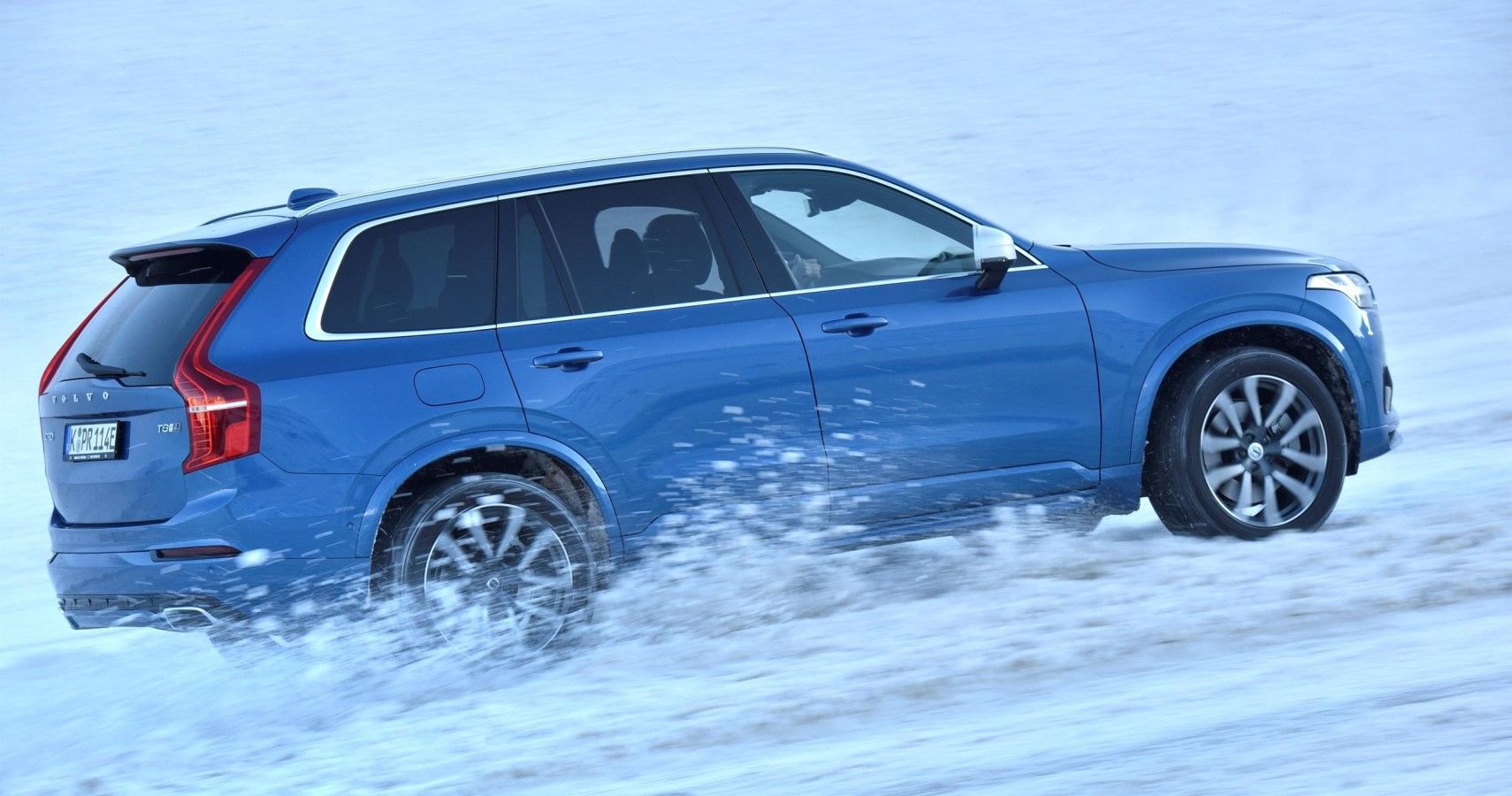 2017 Volvo XC90 driving in snow side view