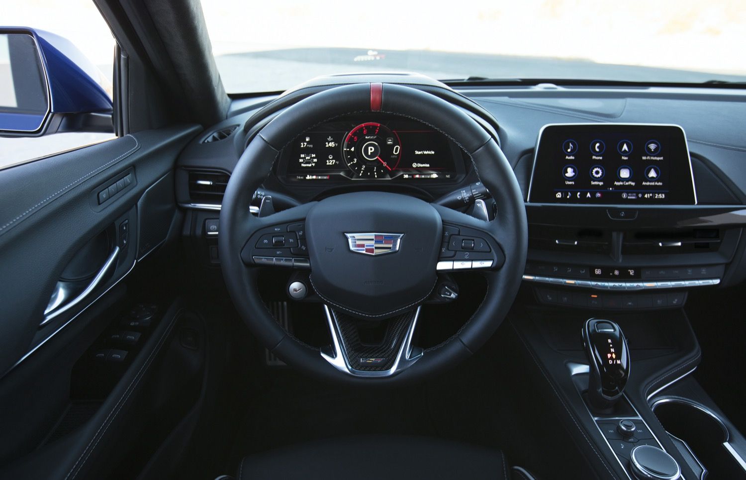 2022-Cadillac-CT4-V-Blackwing-Interior-Level-2-001-Jet-Black-cockpit-steering-wheel-with-carbon-fiber-trim-and-red-stripe-digital-gauge-cluster-center-stack