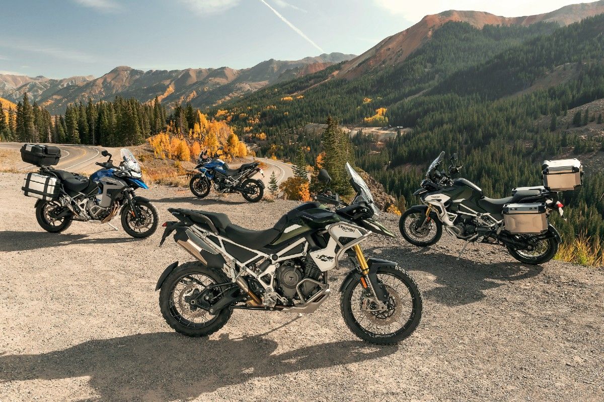 The 2022 Triumph Tiger 1200 model line parked with a mountain range visible in the background.