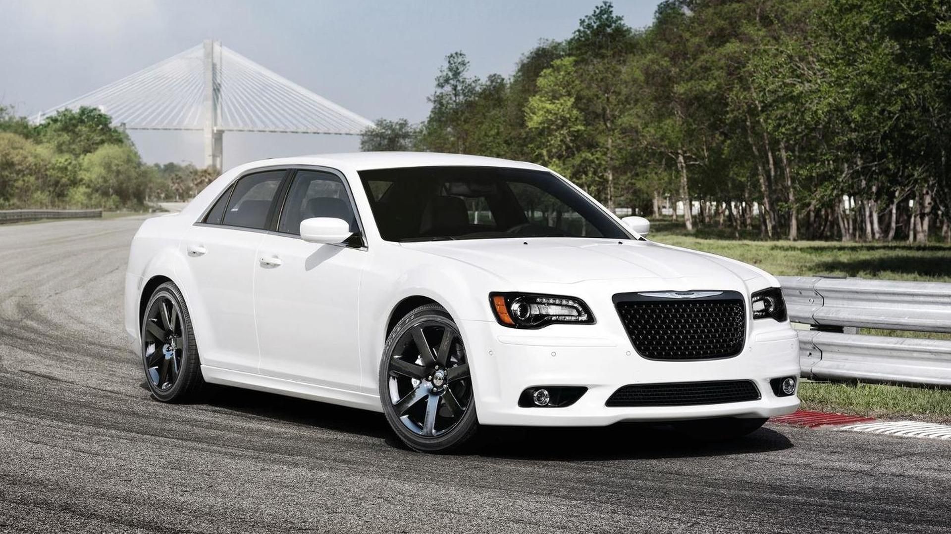White 2012 Chrysler 300C SRT8 being driven in front of a bridge