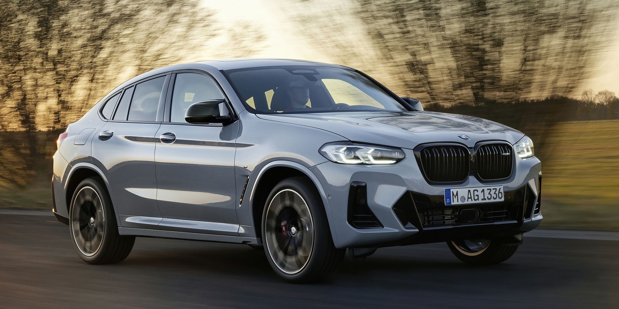 Front 3/4 view of the BMW X4 on the move