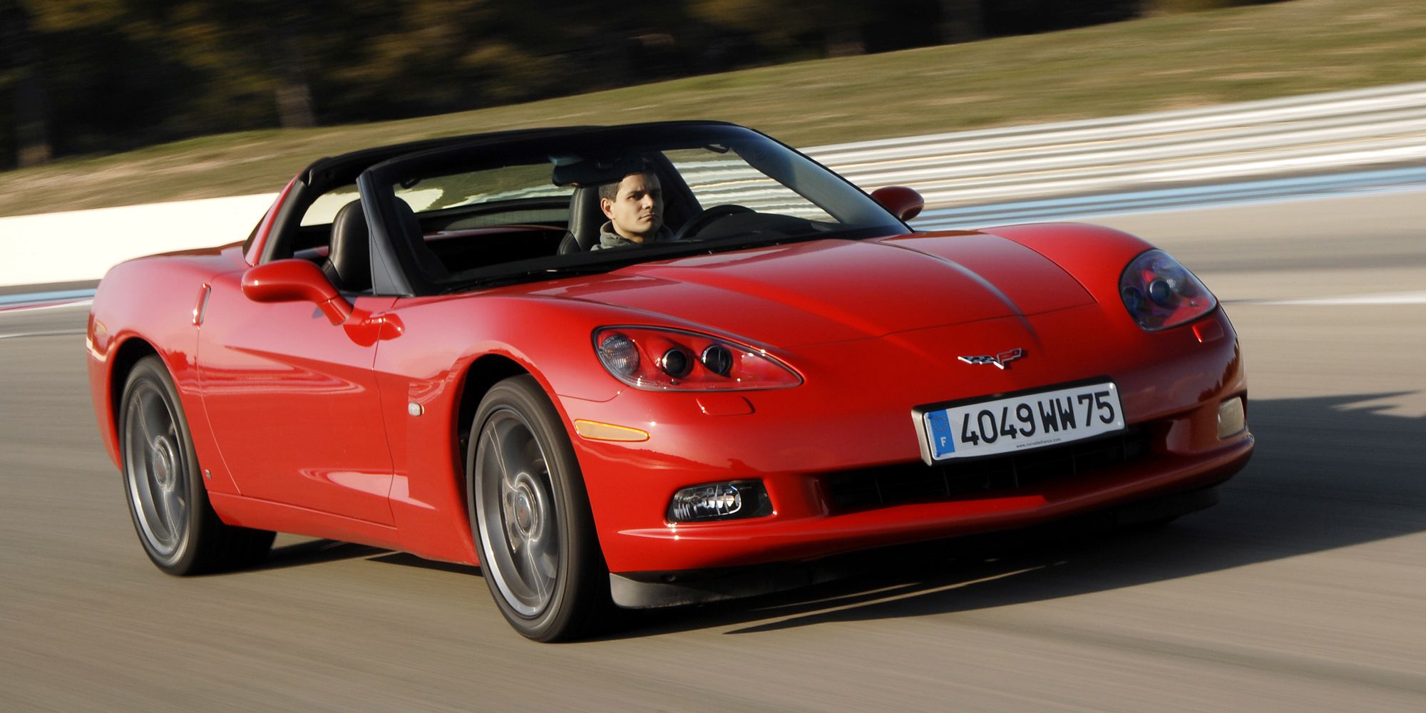 A red C6 Corvette on the move