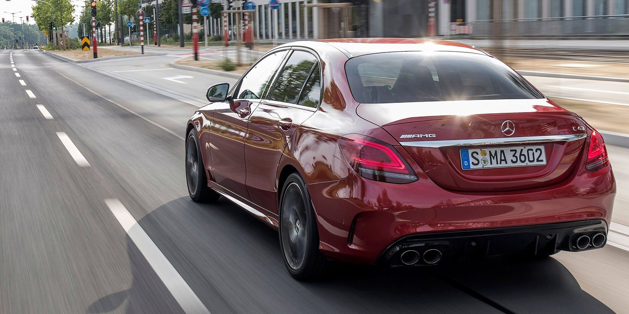 The rear of a red C43 AMG on the move