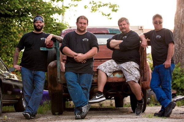 Misfit Garage Team in Front of a Classic Vehicle