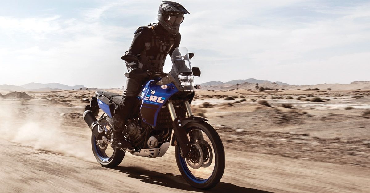 Person riding Yamaha Tenere 700 in the desert