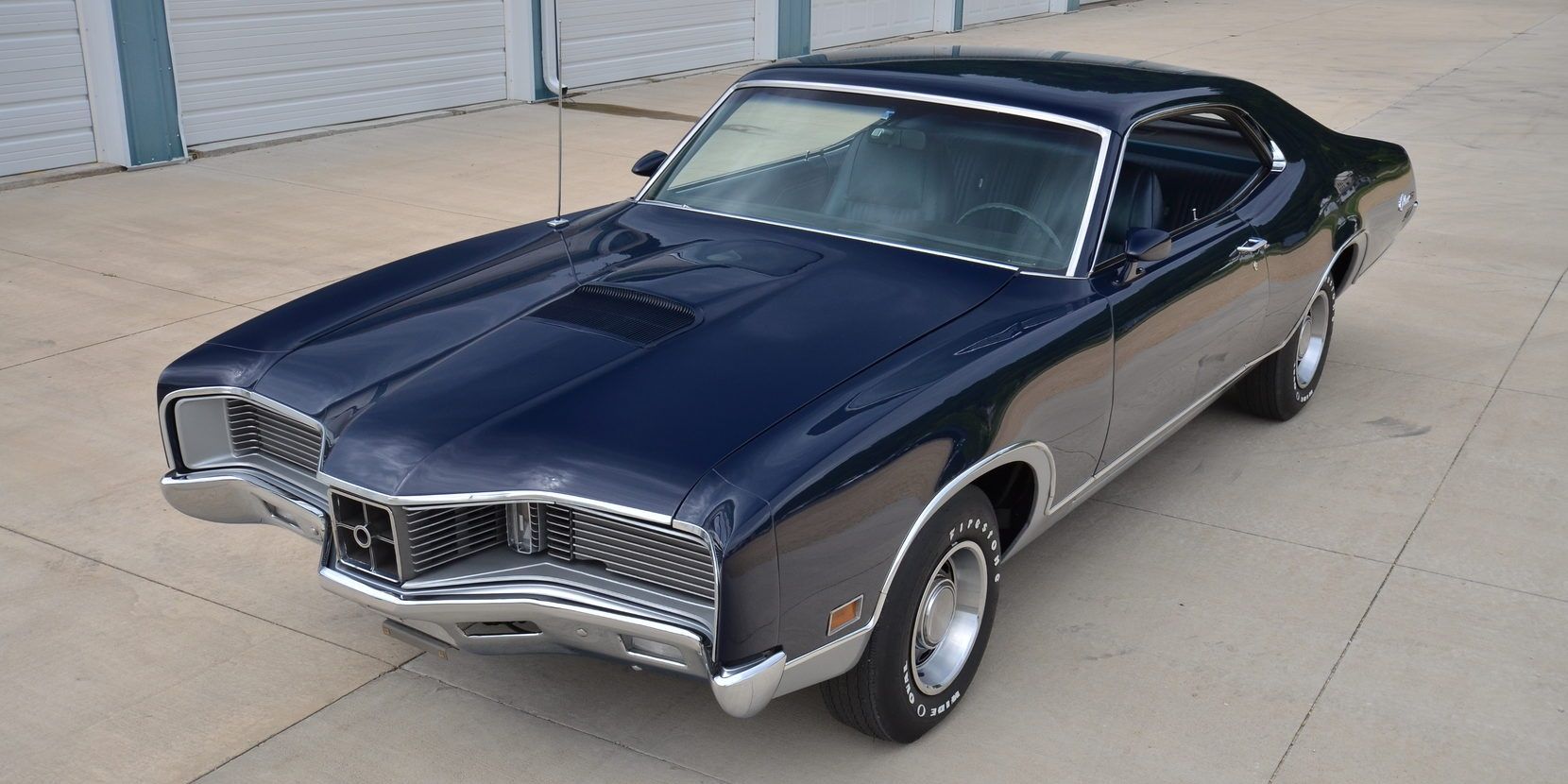 A black 1970 Mercury Cyclone GT parked in storage area