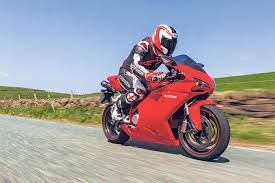 A Person Riding A Red Ducati 1098