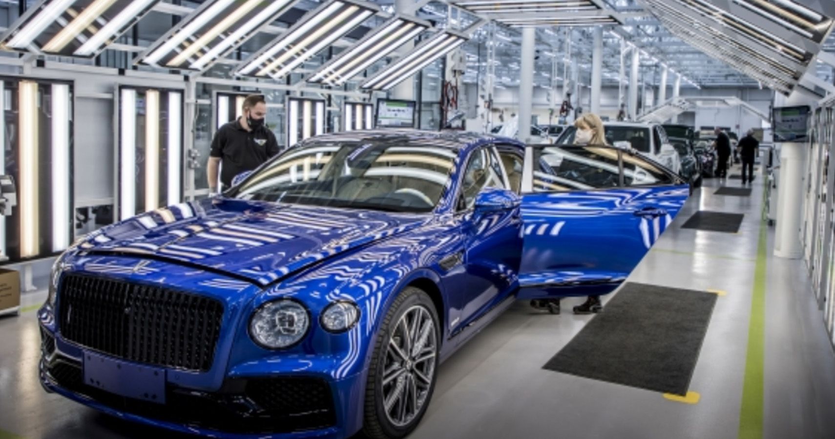 Blue Bentley vehicle rolling out of Crewe plant