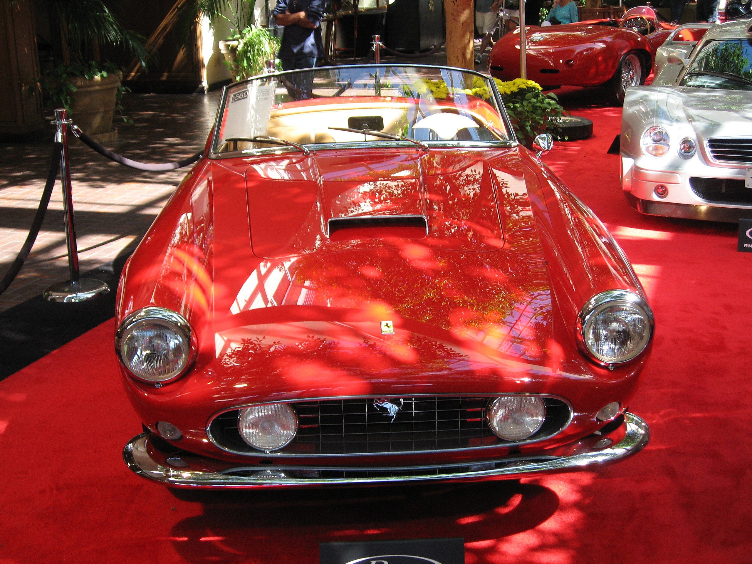 Ferrari 250 GT California Spyder in red at a car show