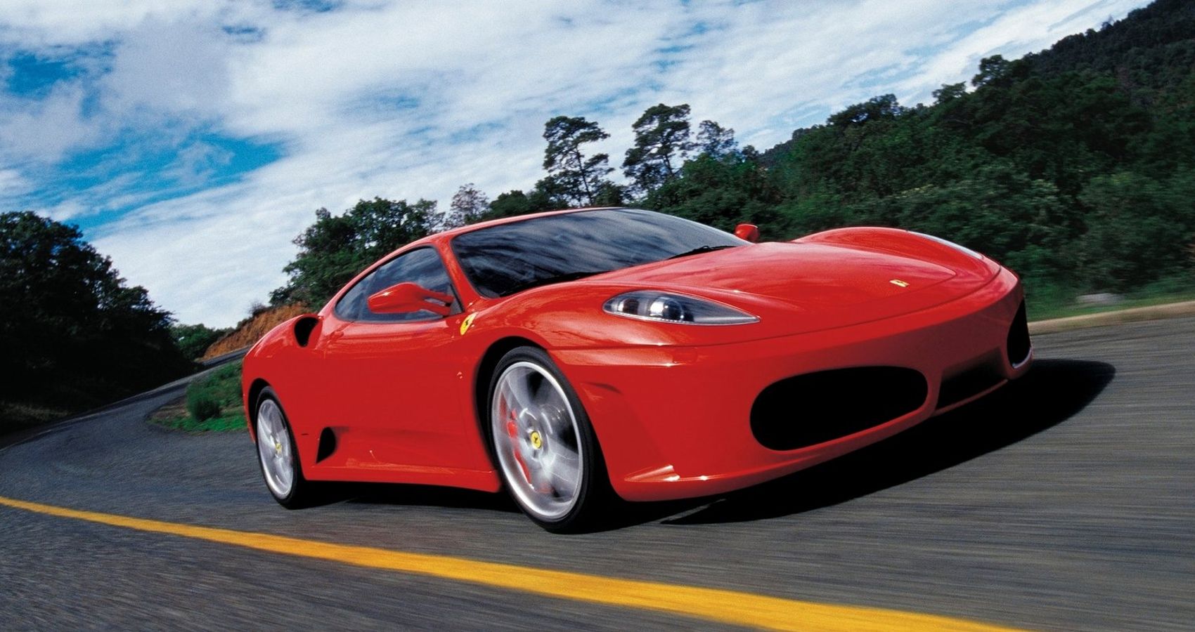 Front 3/4 view of a red F430 on the move