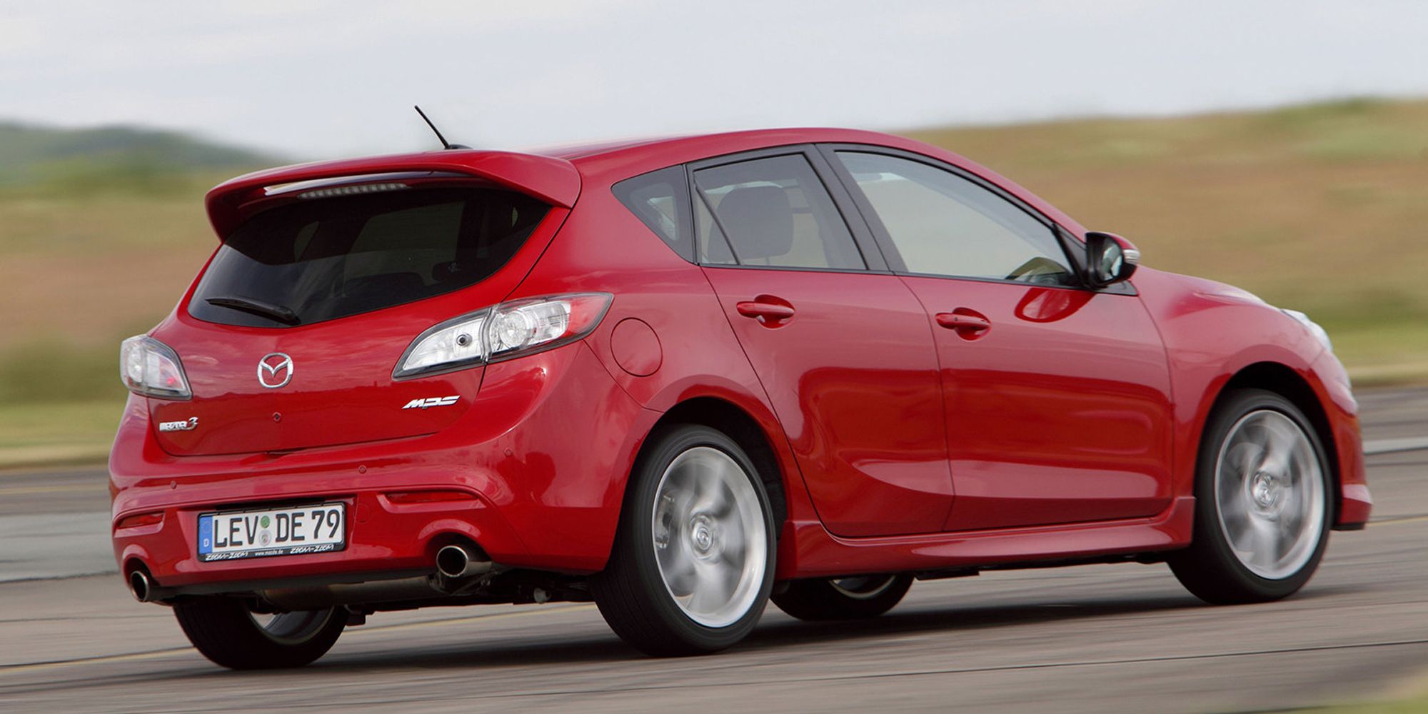 Rear 3/4 view of the Mazdaspeed 3 on the move