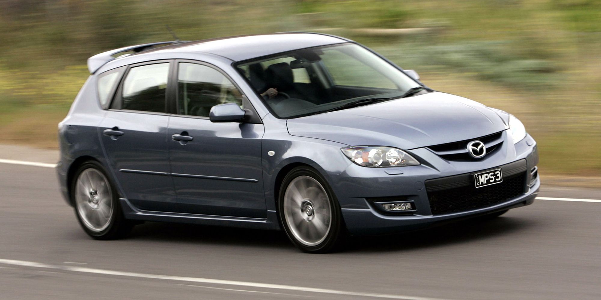 Front 3/4 view of a first gen Mazdaspeed 3 on the move