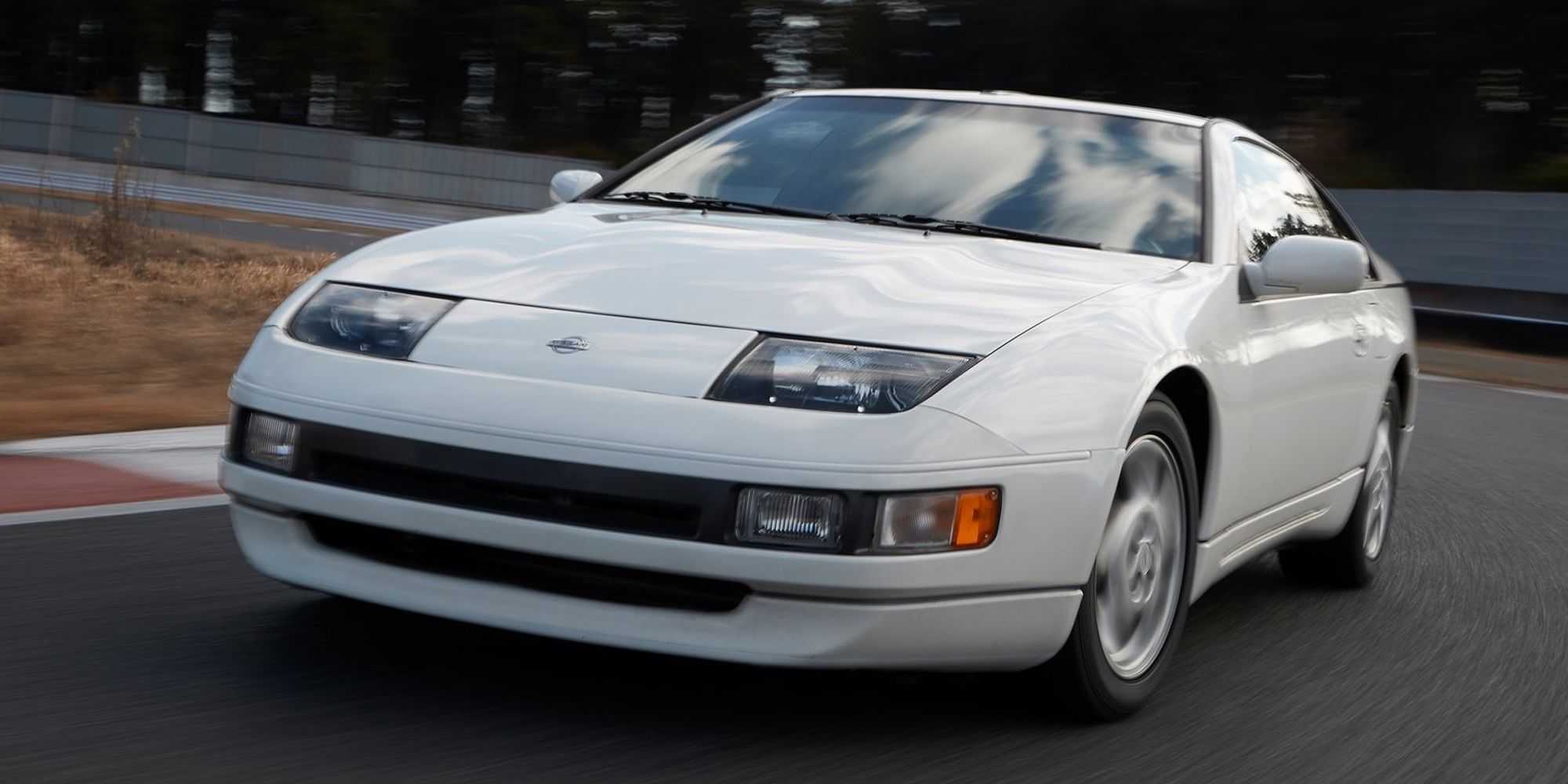 The front of a white 300ZX on track