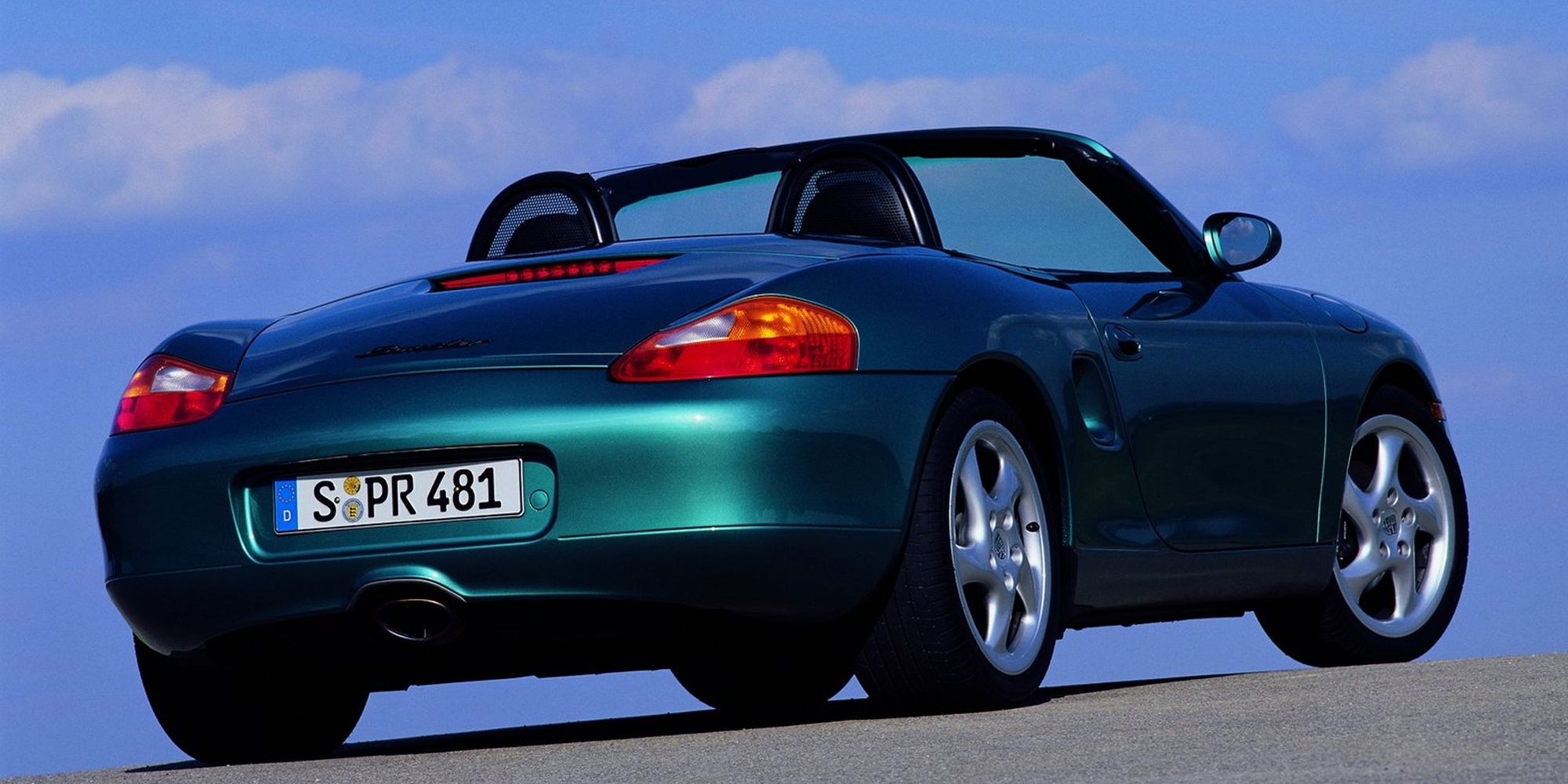 The rear of a green Boxster