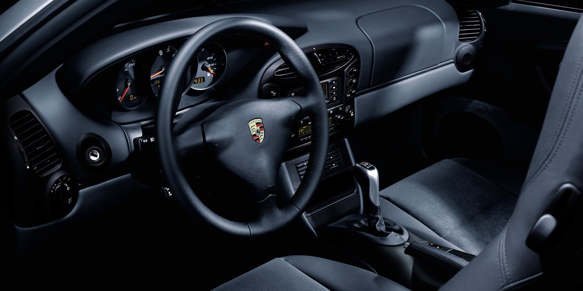 The interior of the pre-facelift 986 Boxster, in black